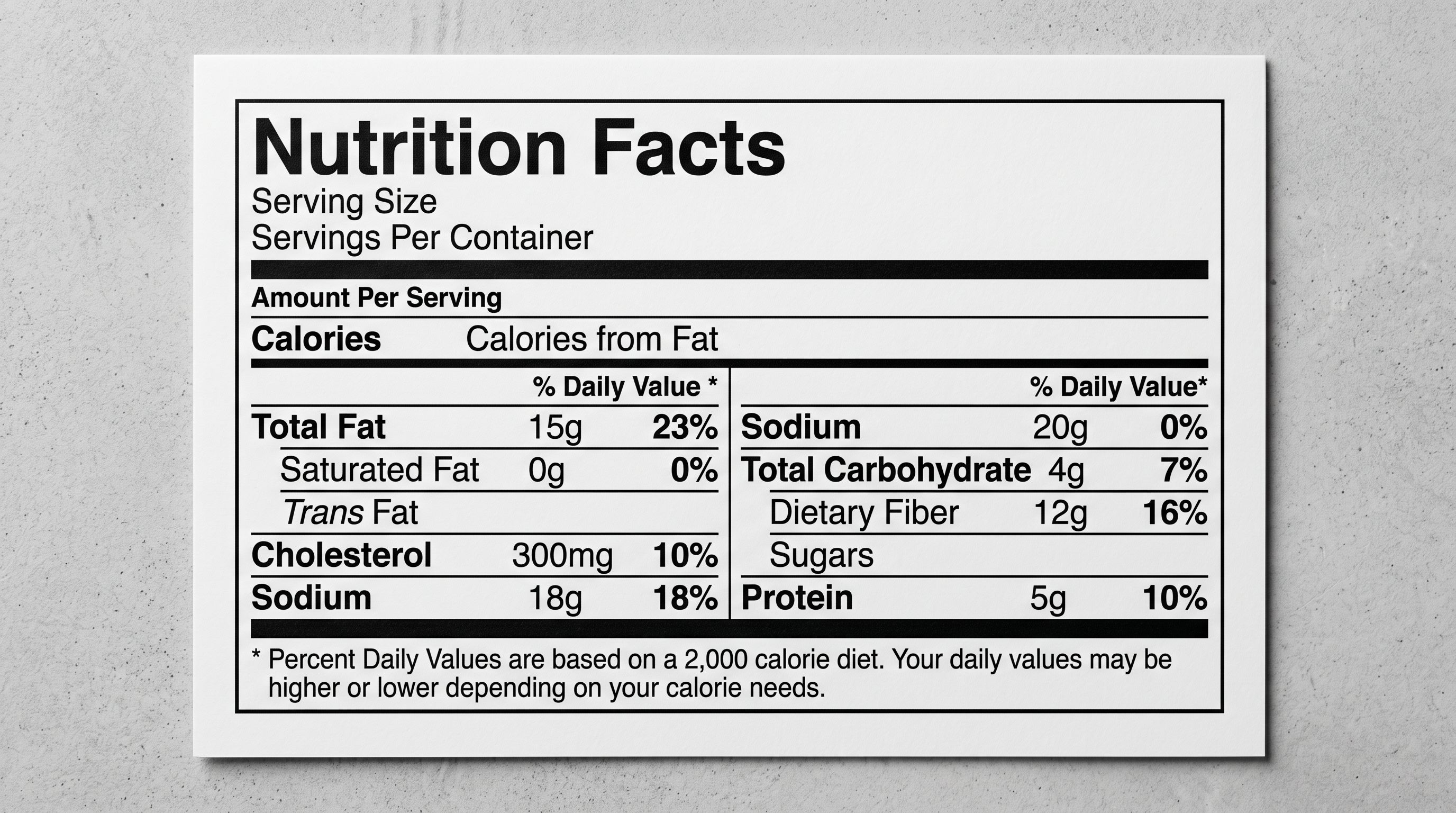 A close-up of a printed product nutrition label on white card stock lying flat on a plain surface.