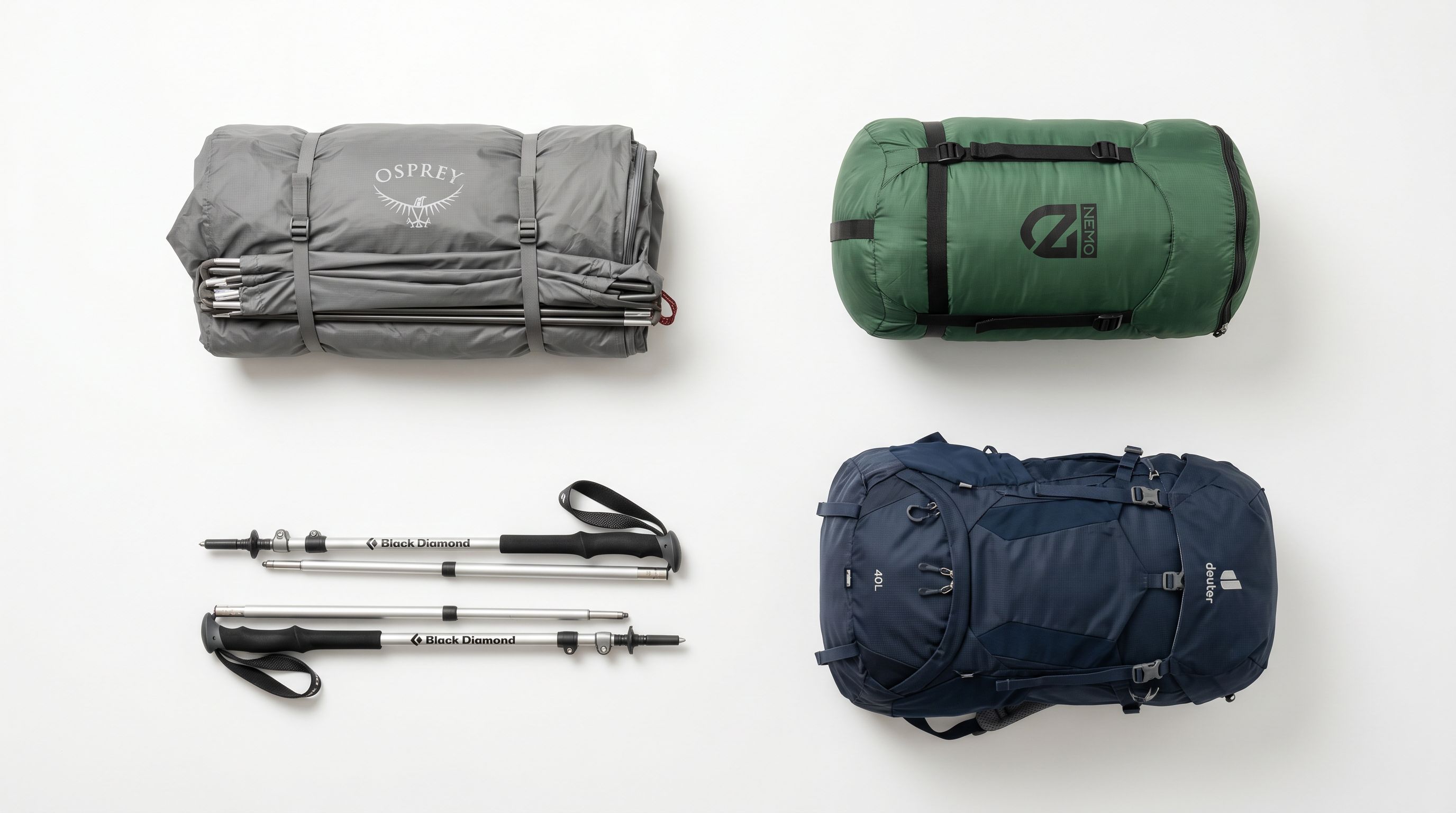 Outdoor camping and hiking equipment laid out flat in an organised grid on a white background: tent, sleeping bag, poles, and pack.