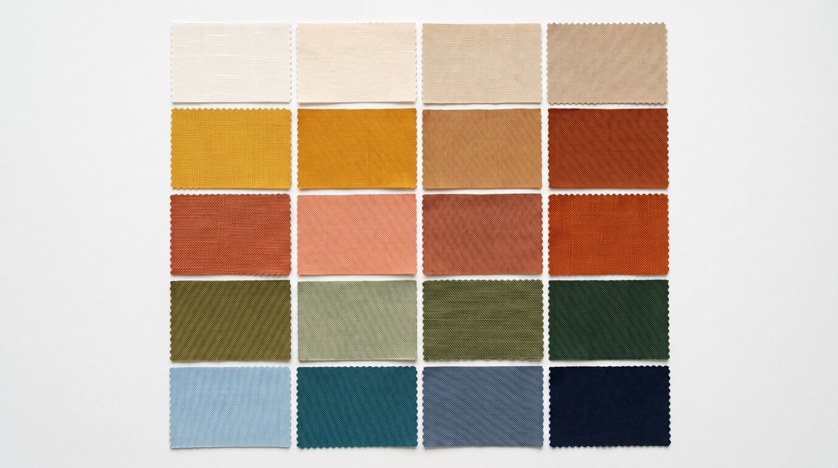 Overhead view of fabric colour swatches arranged in a precise grid representing variant combination options.