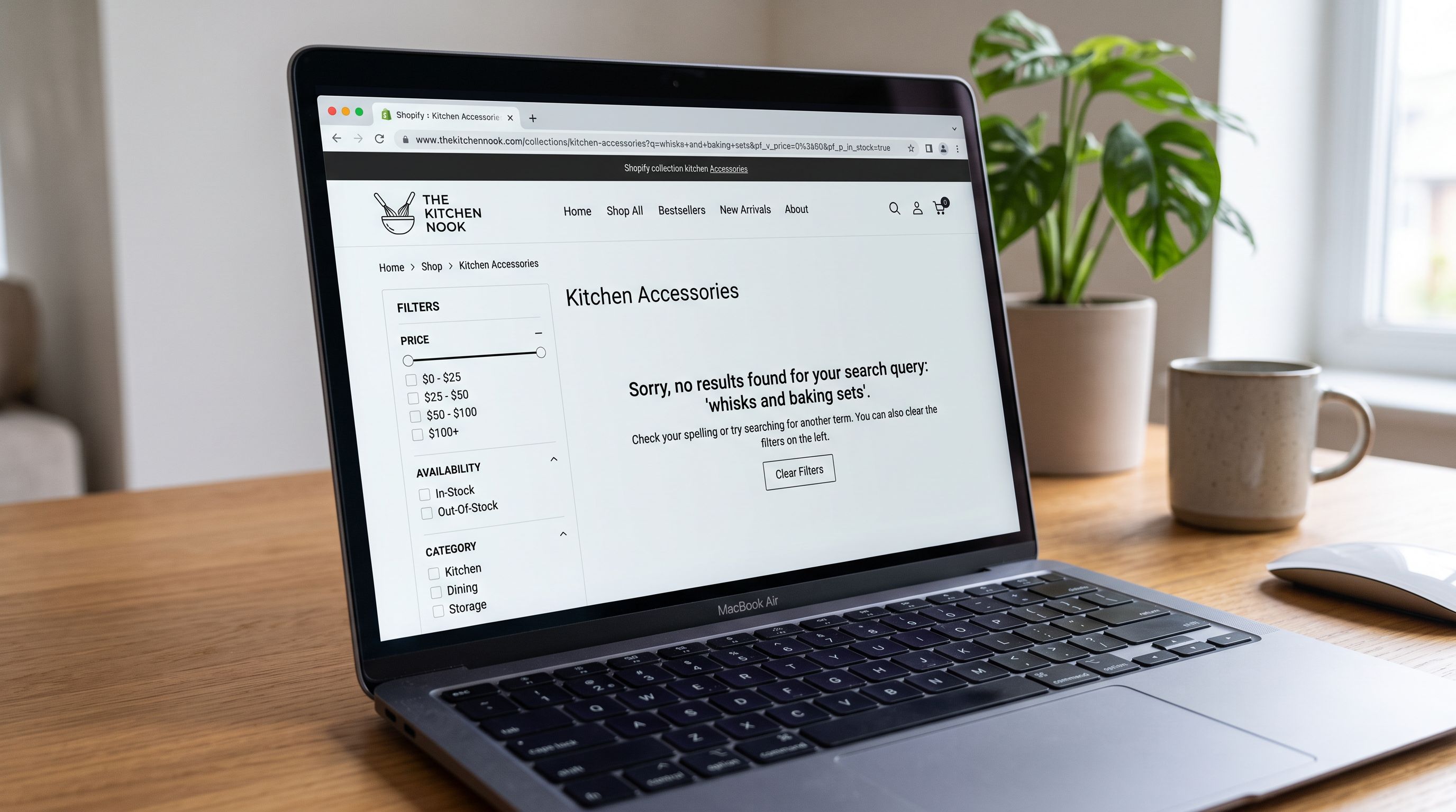 A Shopify collection page on a laptop screen showing a filtered kitchen accessories collection with only Price and In-Stock filters available in the left panel, and a search bar showing a completed query for food-safe ceramic with zero results message, sharp focus, colour photography.