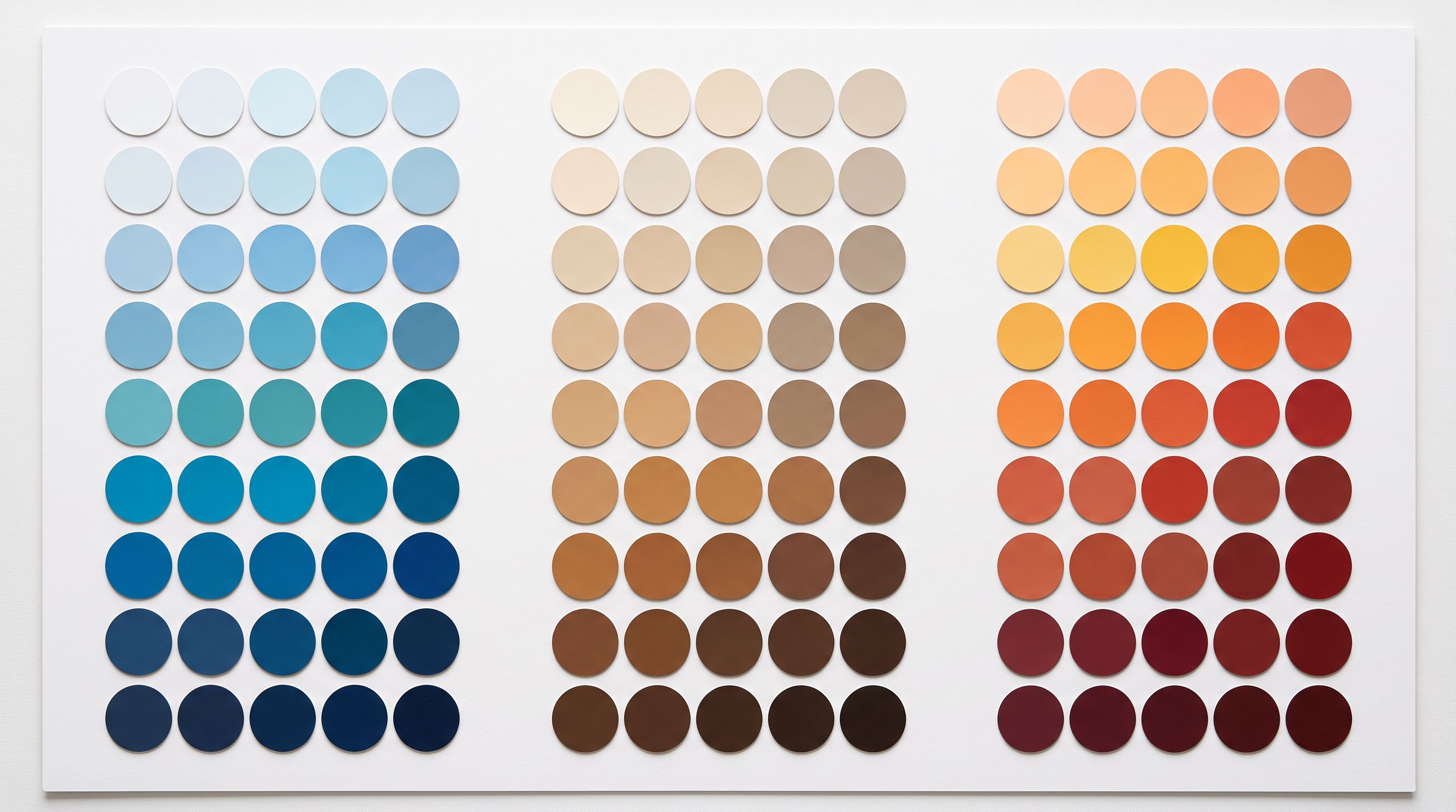 Circular paint colour chips sorted into three columns showing distinct colour families and gradients.