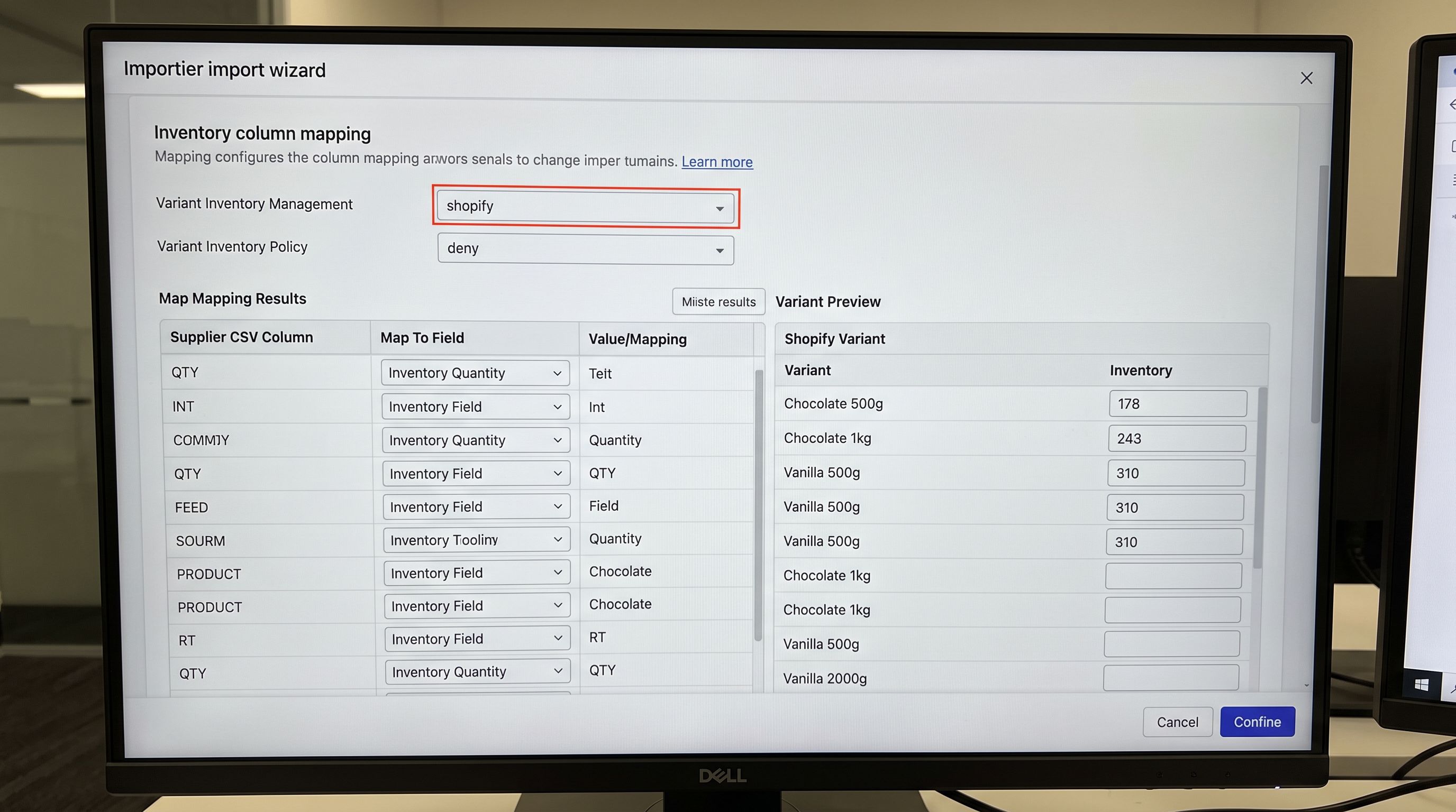 An Importier import wizard on a large monitor showing the Variant Inventory Management field set to shopify and the Variant Inventory Policy set to deny in the column mapping section, with the variant preview table visible below showing per-variant inventory quantities correctly mapped from the supplier CSV rows to individual Shopify variant records, everything in sharp focus no blur no depth of field, colour photography.