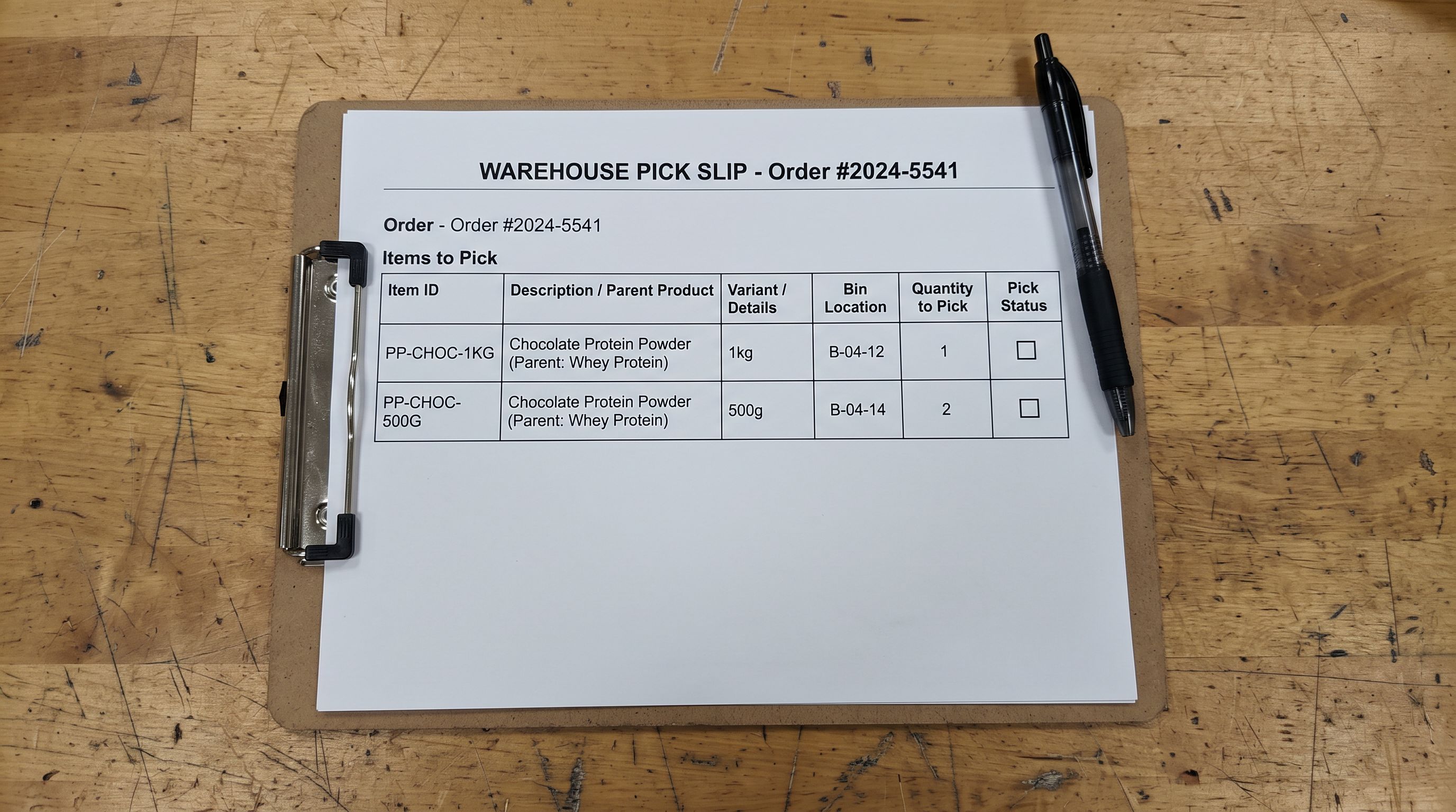 A warehouse fulfilment pick slip on a clipboard on a workbench showing two line items listed as variants of the same product: Chocolate Protein Powder 1kg and Chocolate Protein Powder 500g both grouped under the parent product name with individual variant quantities to pick, representing correct fulfilment routing when products are correctly structured as variants, everything in sharp focus no blur no depth of field, colour photography.